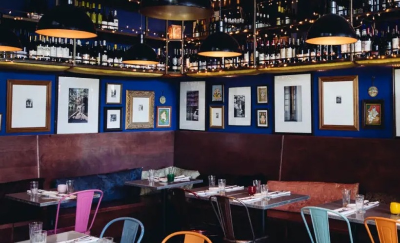 a room with tables and pictures