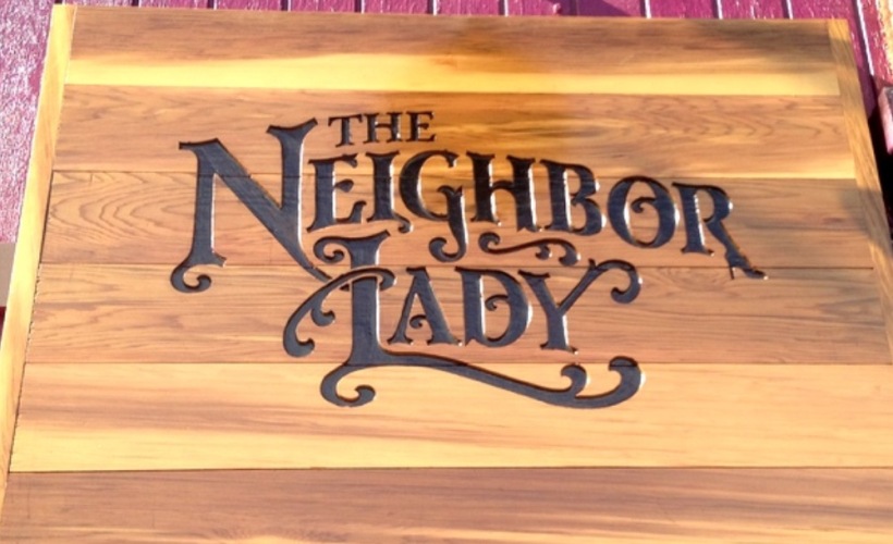 a wooden sign with letters 